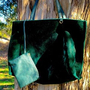 Emerald green velvet bag with small interior bag.